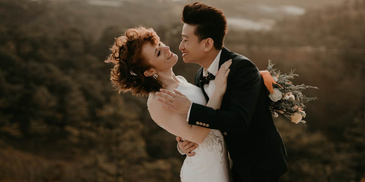 bride and groom embracing 