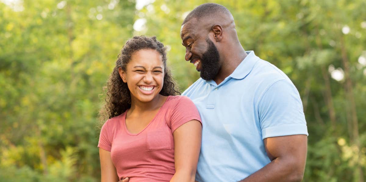 father and his daughter smiling