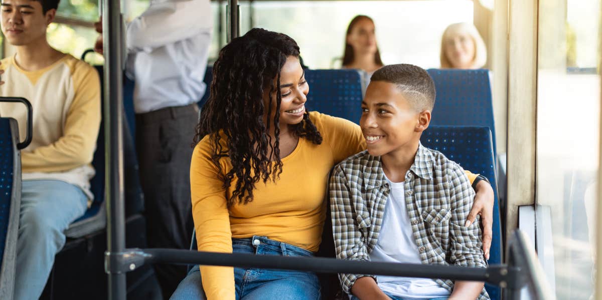 mom and son sitting on public transport