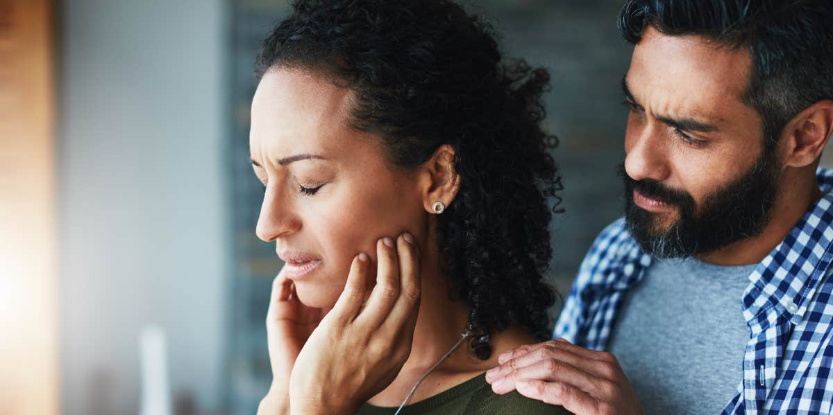 man comforting distraught wife