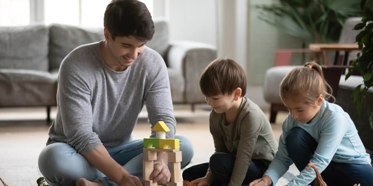 Man playing with children