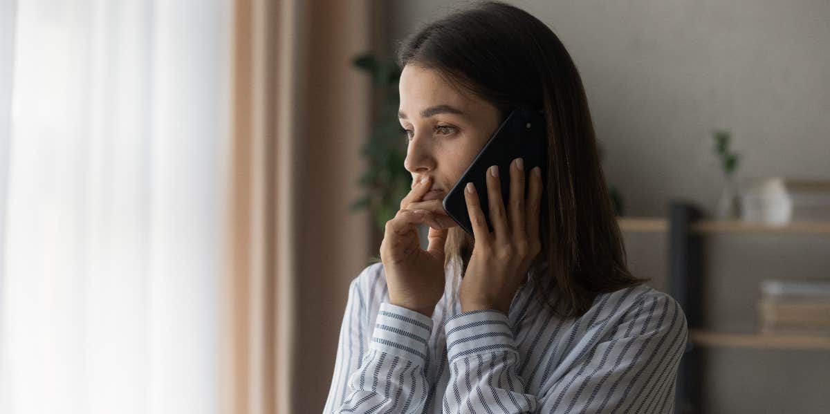 woman upset while on the phone