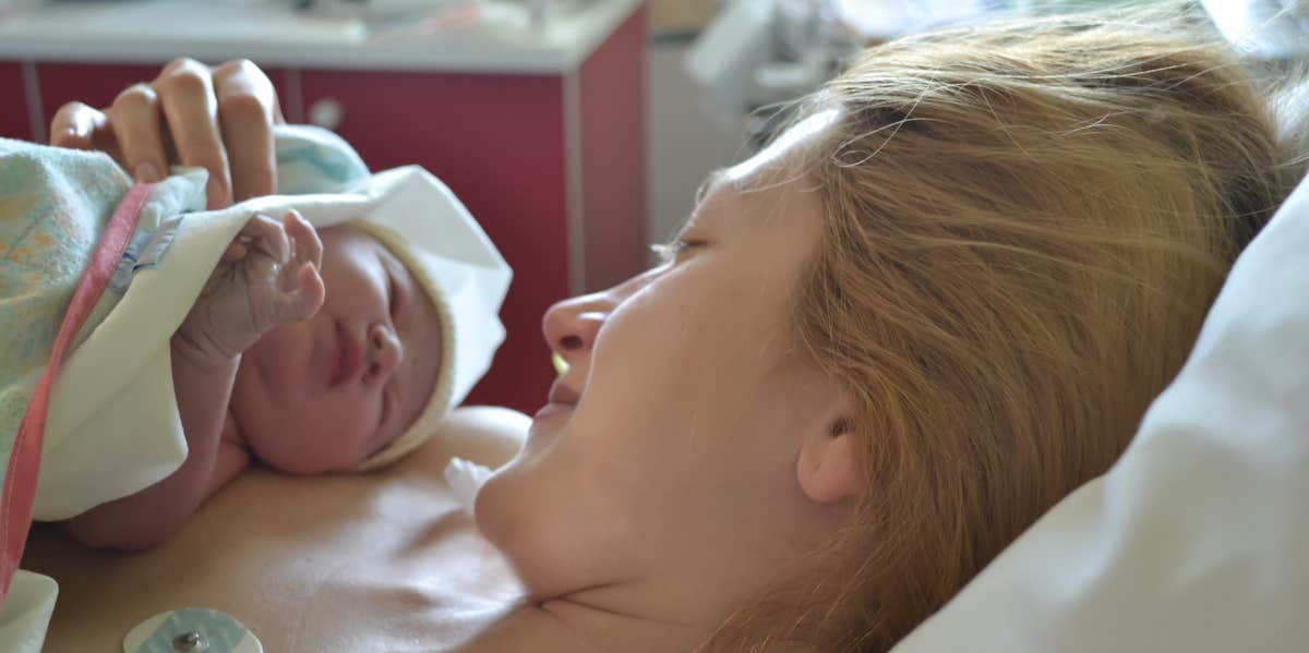 Mother and newborn in hospital bed after childbirth