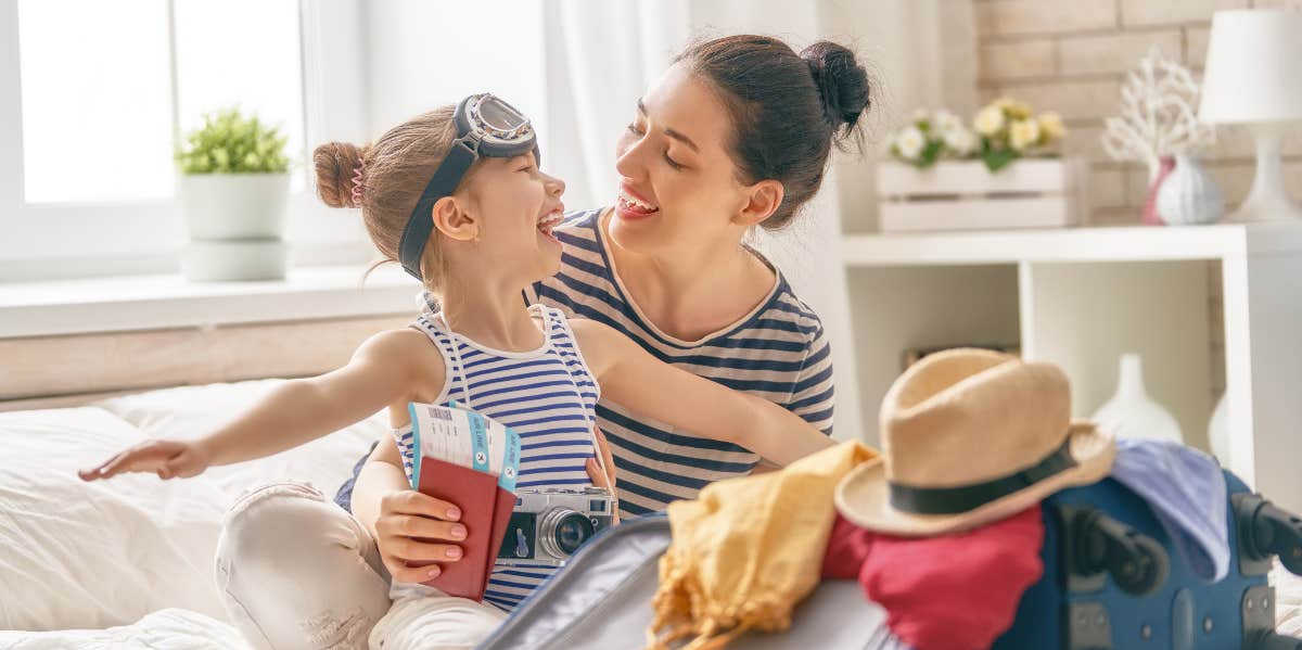 Woman and little girl packing for trip