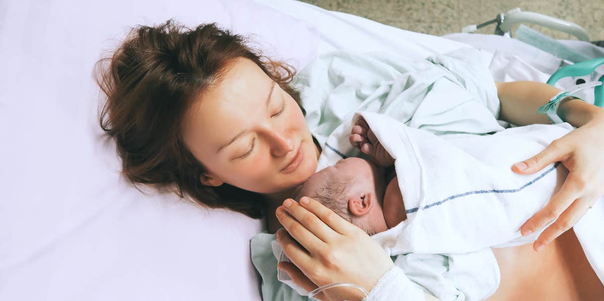 mother holding newborn baby