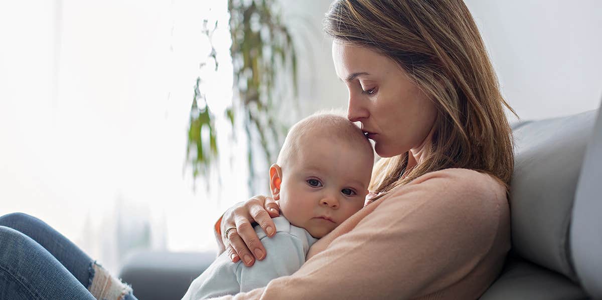 mother holding baby