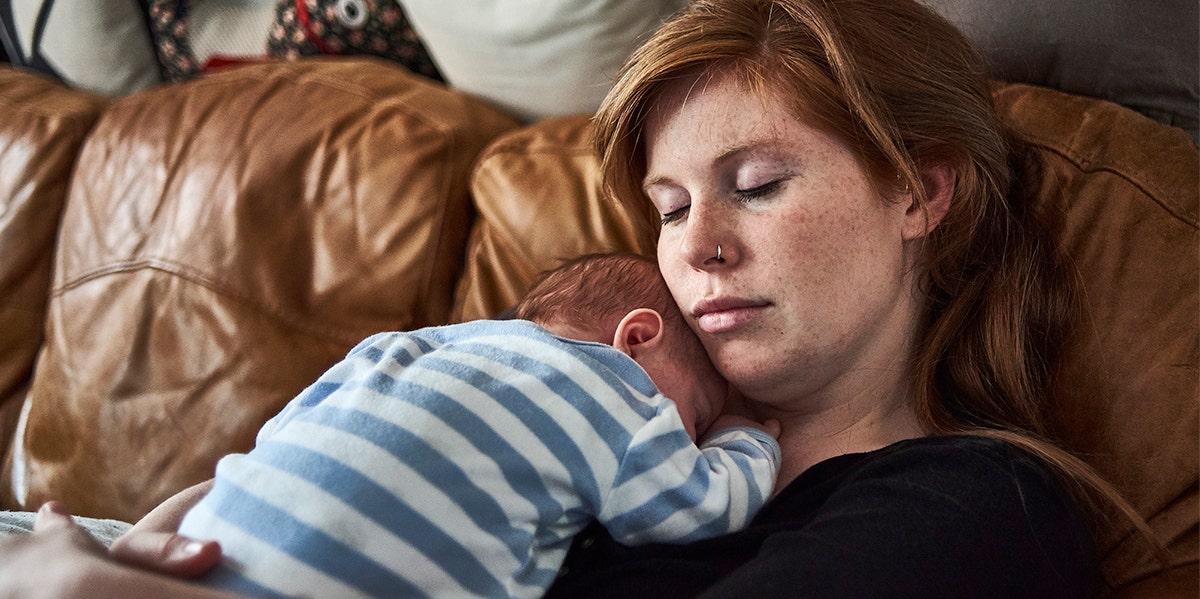 woman with baby on chest