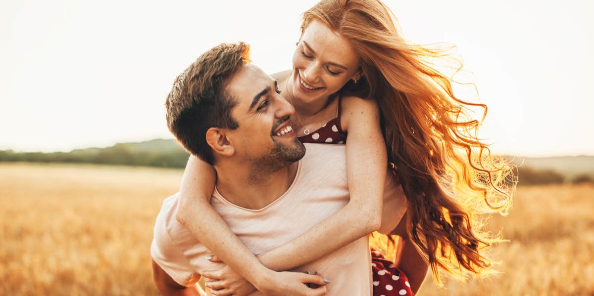 happy couple in field