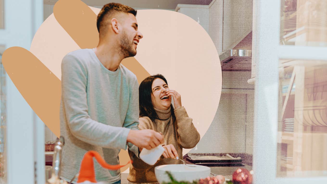 Couple in kitchen together laughing