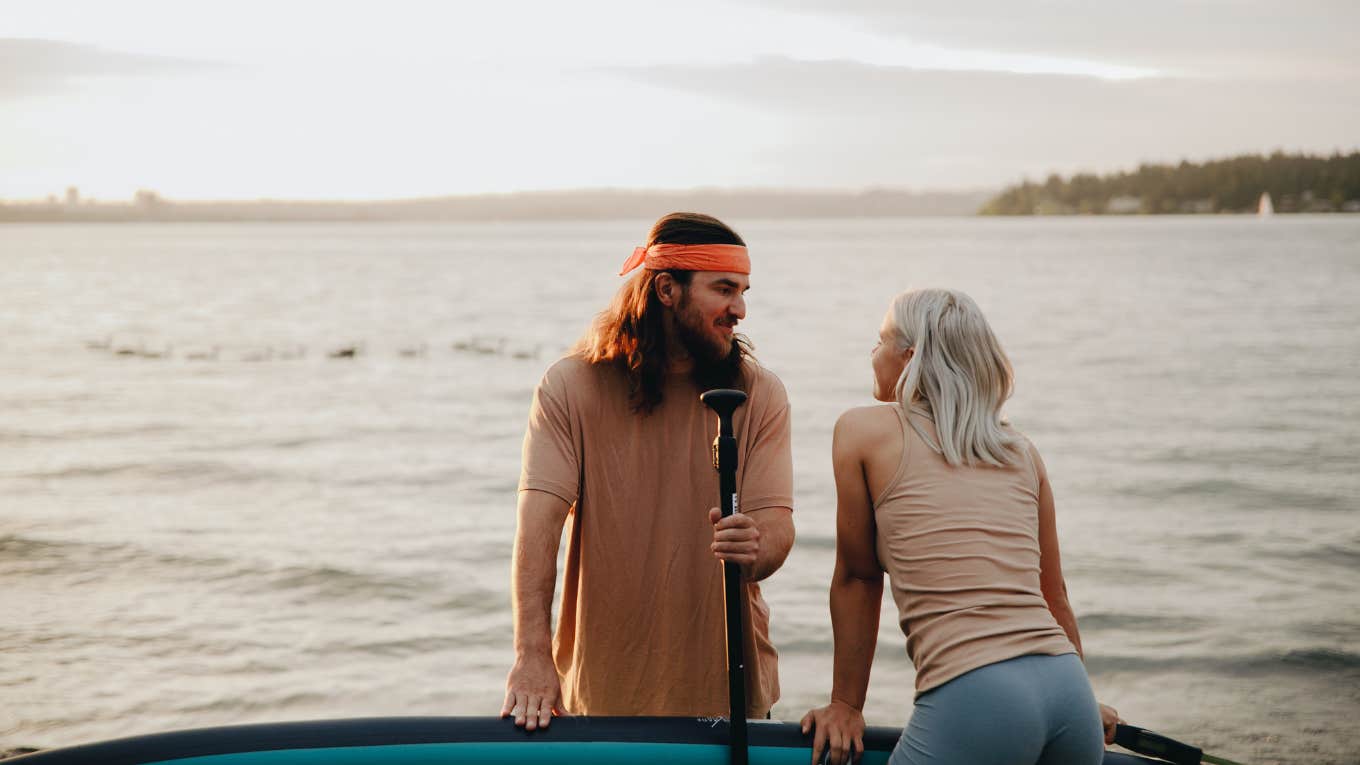 Couple flirting before heading out on kayak