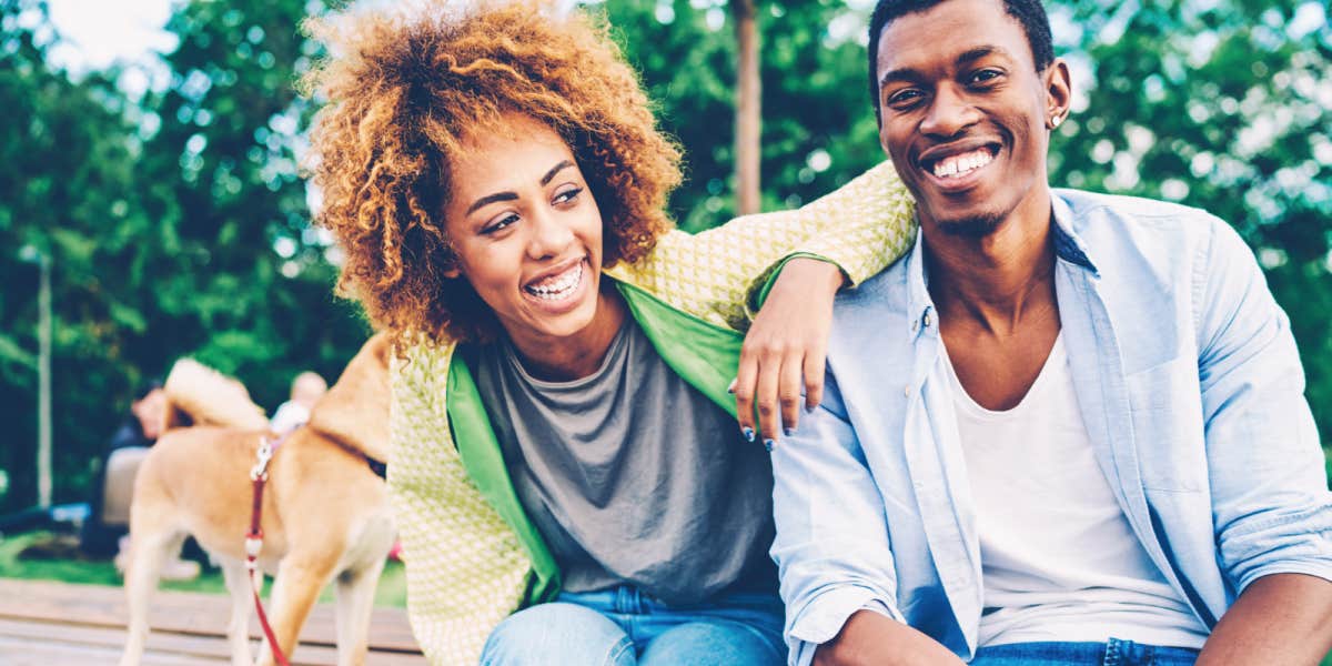 Black couple smiling outdoors