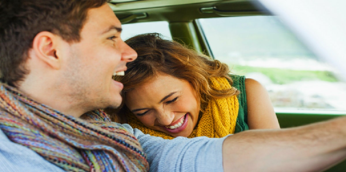 boyfriend and girlfriend driving in car together