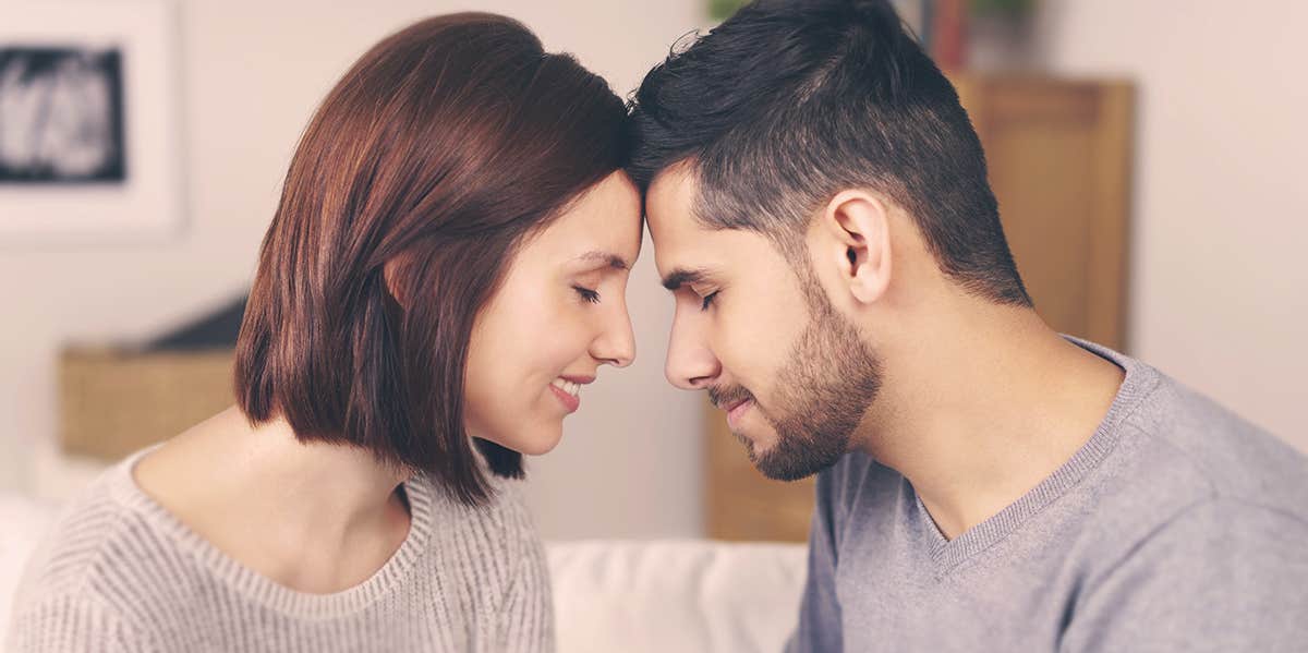 Relationships Only Work If The Man Is The More Interested Of The Two couple touching their foreheads together