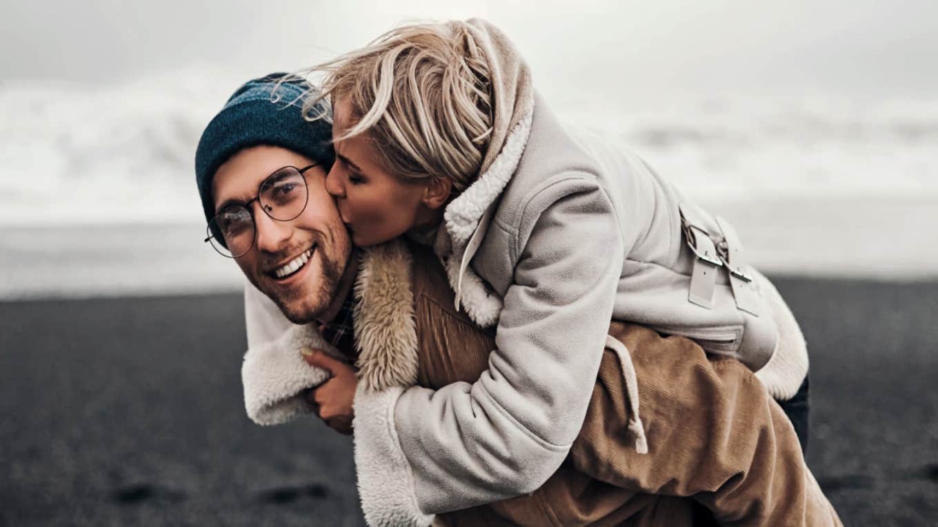 couple piggyback smiling