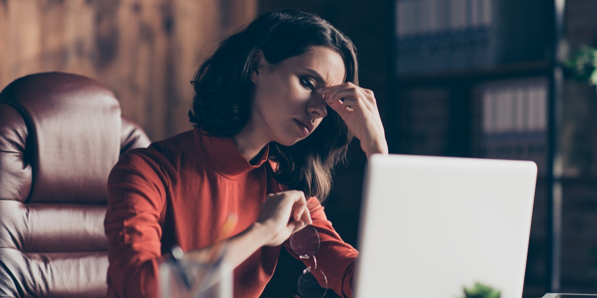 stressed woman working at computer