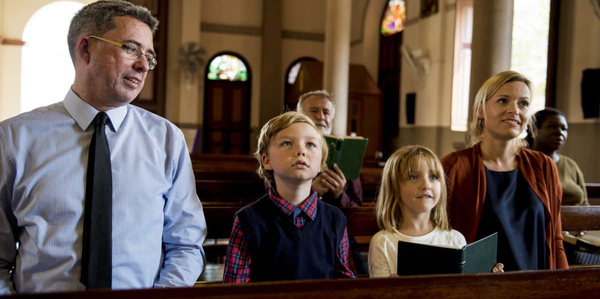 family sitting at church