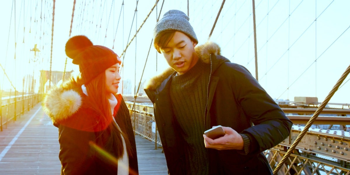 man and woman bickering on bridge