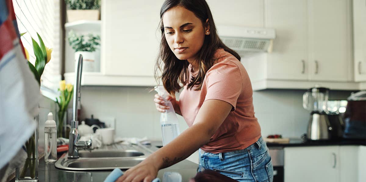 woman cleaning kitchen