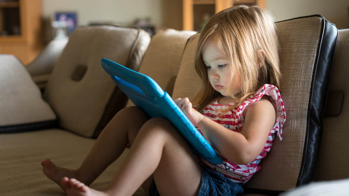 little girl on tablet