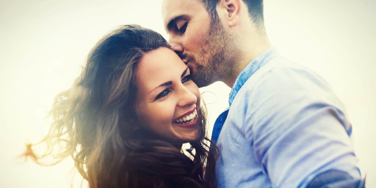 couple embracing in the sunlight