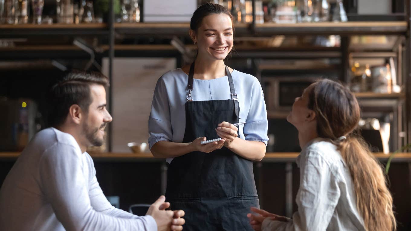 waitress talking to customers