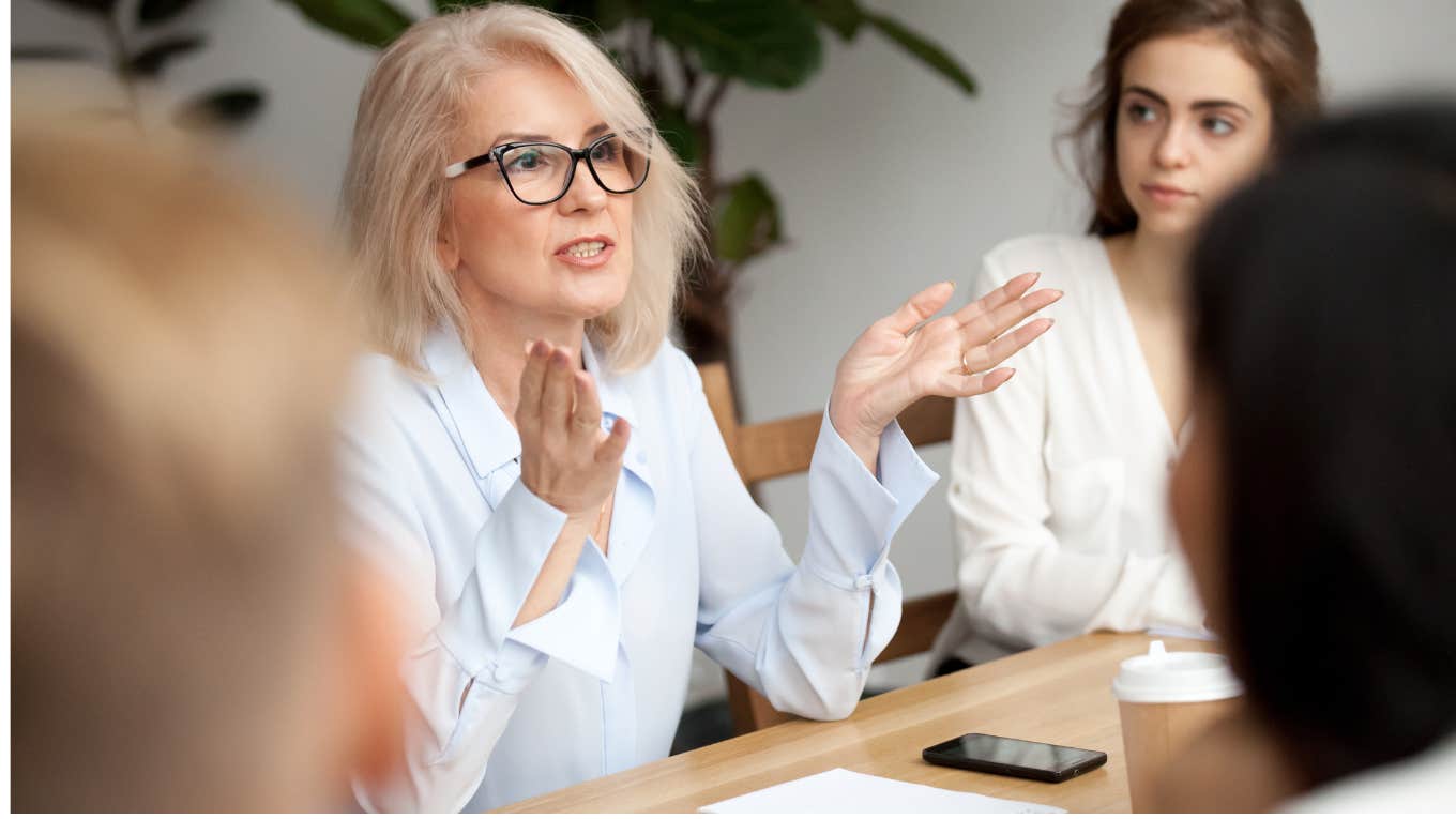 Company Called A 'Women-Only' Meeting To Say They Needed To Return To The Office Woman leading a corporate meeting