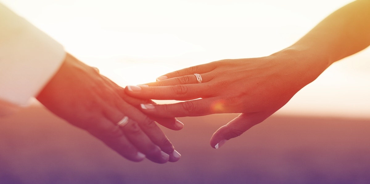 wedding rings on hands