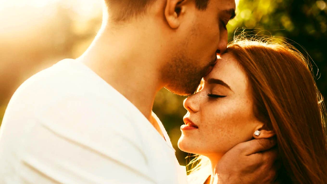 sweet couple, man kissing woman on the forehead