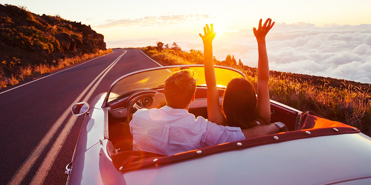 We Met On Twitter — And Our First Date Was A Week-Long Road Trip couple in car at sunset