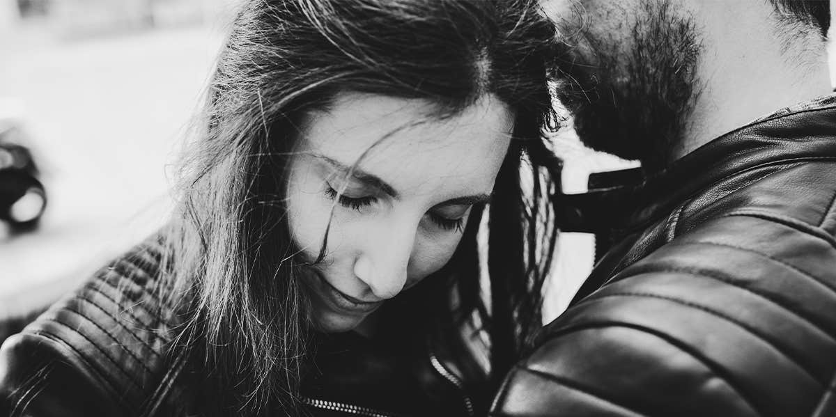 75% Of Women Say This Unsexy Habit Interferes With Their Relationship man hugging woman
