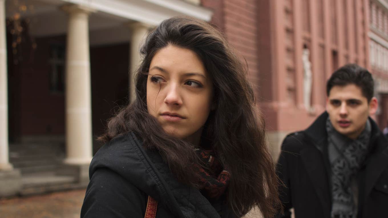 Unhappy woman looking away from partner 