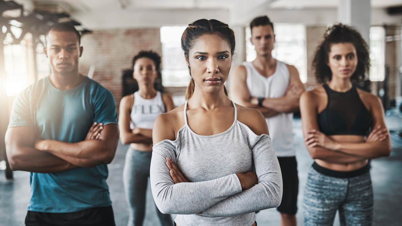 group of people with arms crossed