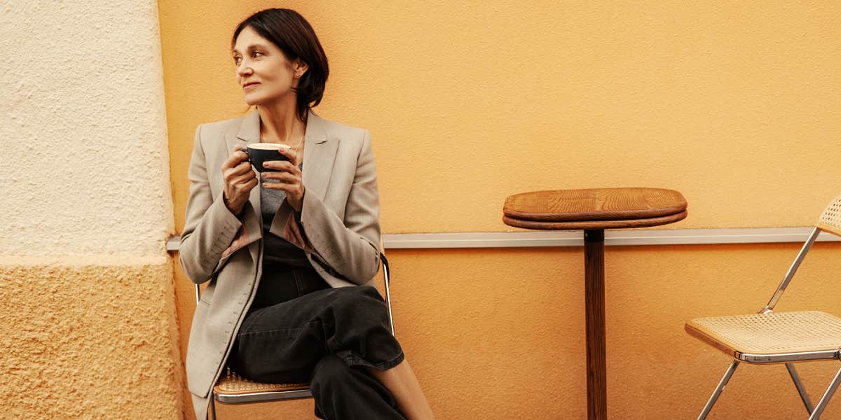 woman alone in a cafe