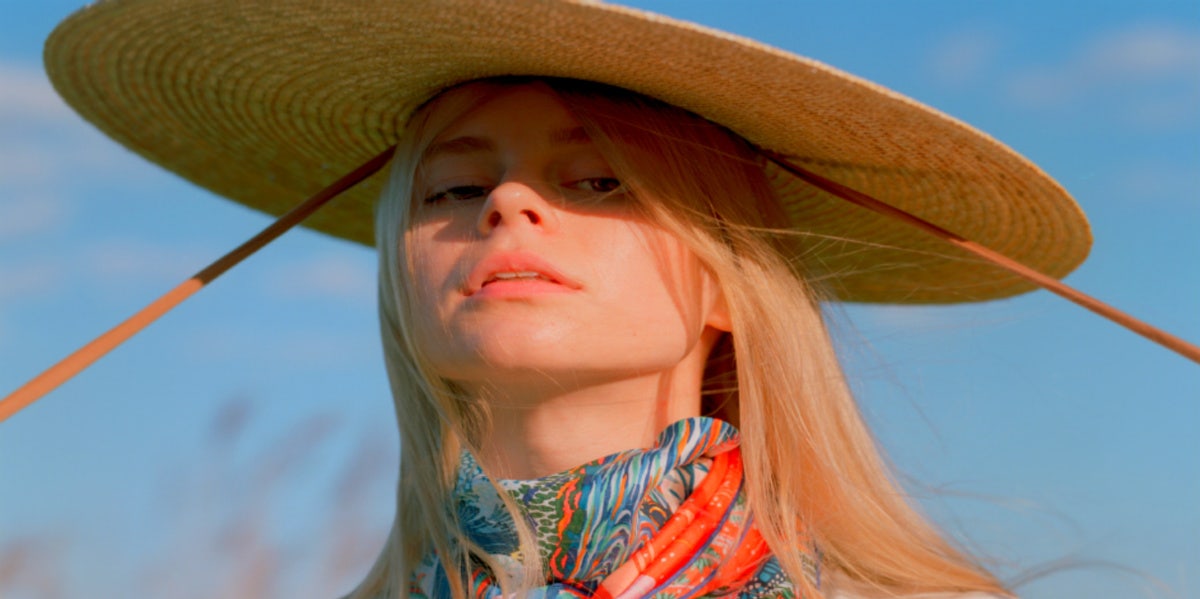 woman with hat in sunlight