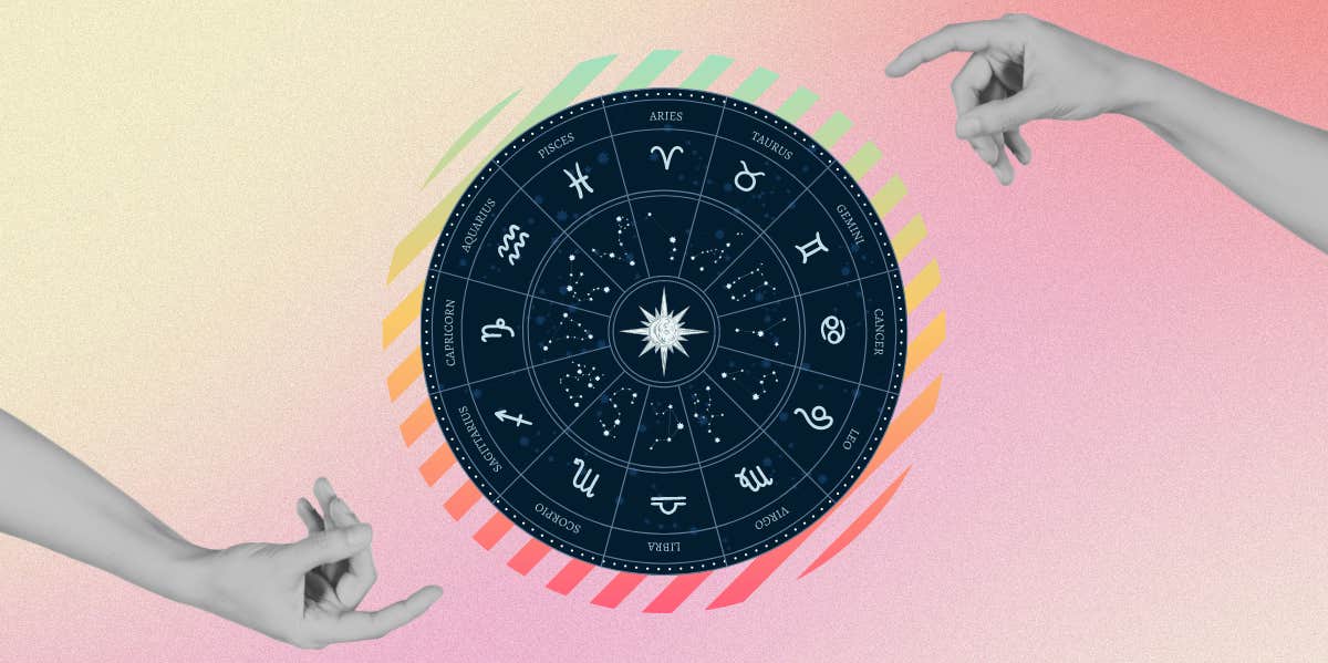 zodiac wheel between two hands