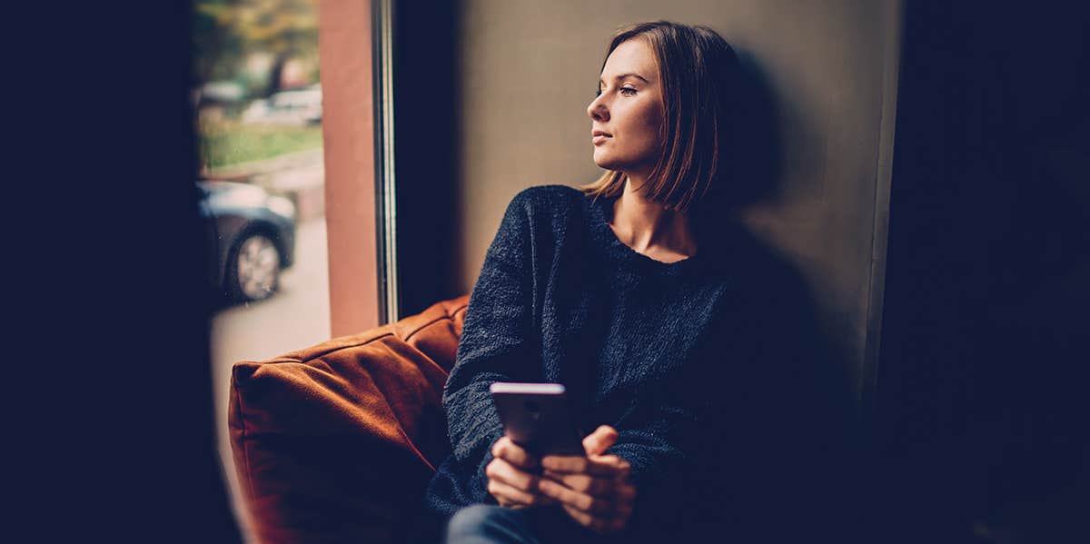 woman looking out of the window