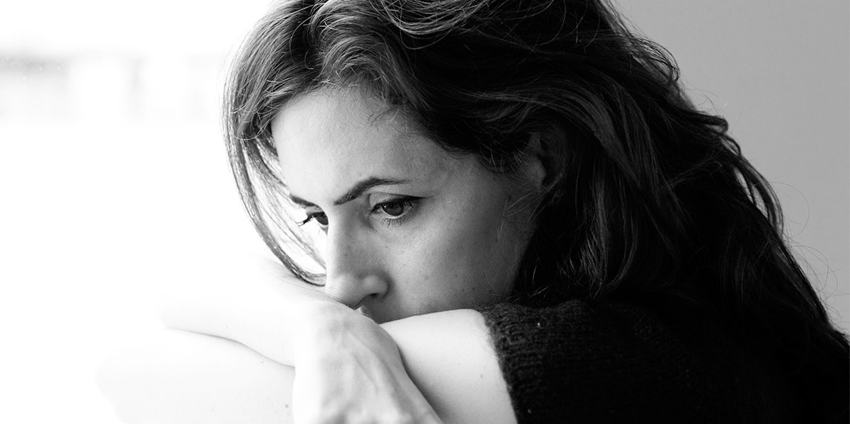 My Best Friend Was Murdered By Her Ex-Husband photo of woman looking behind with face on shoulder