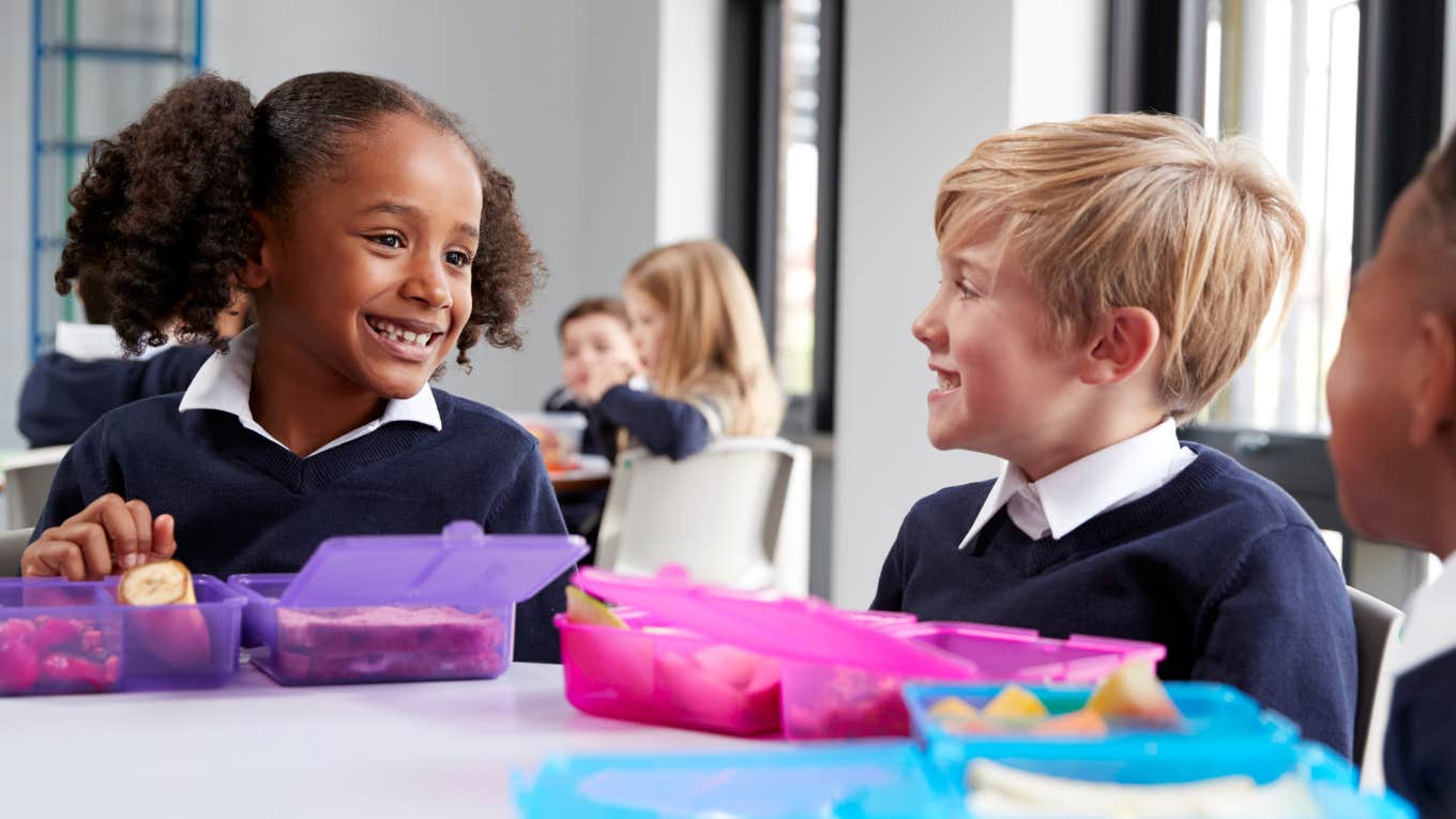 School Board Says ‘Pack A Lunch’ After Being Threatened By Legal Action Over ‘Inedible’ School Lunches Little kids having school lunch in the cafeteria.
