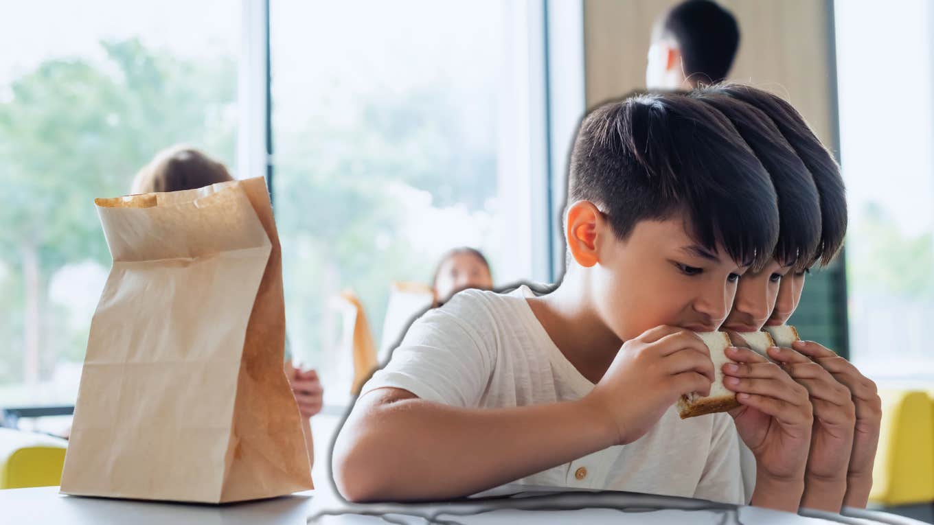 boy eating peanut butter sandwich for lunch