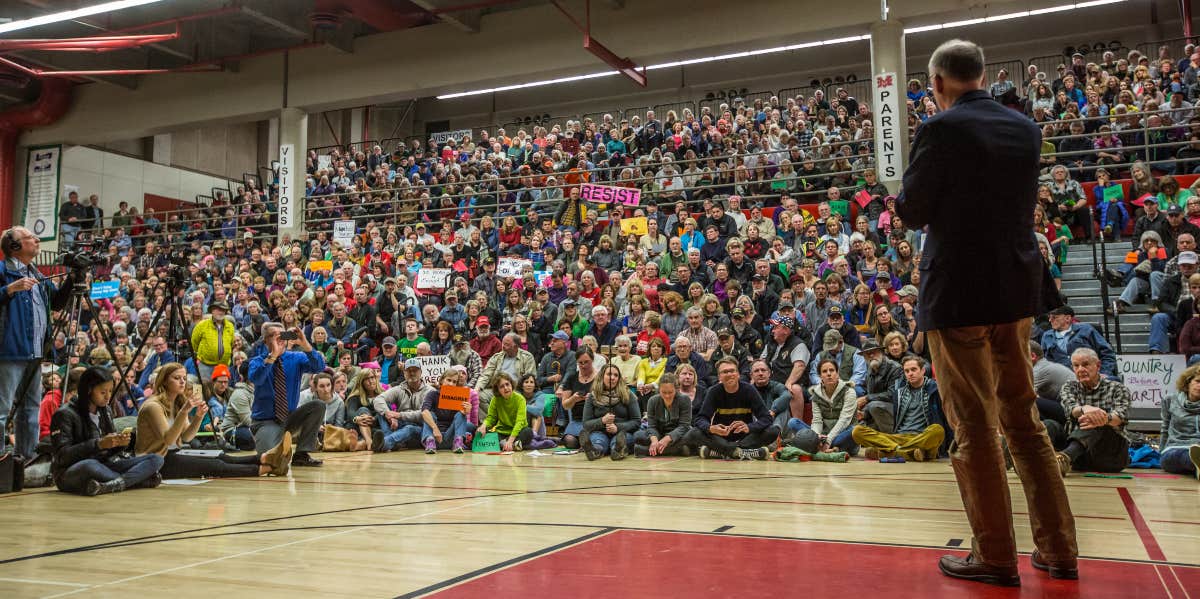 Congressman giving speech at town hall meeting