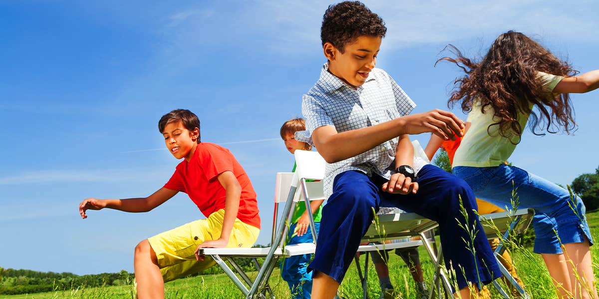 group of kids playing musical chairs