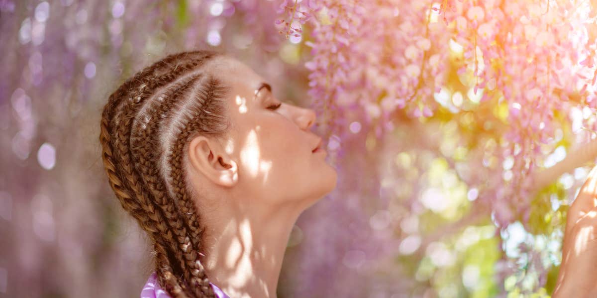 woman smelling flowers