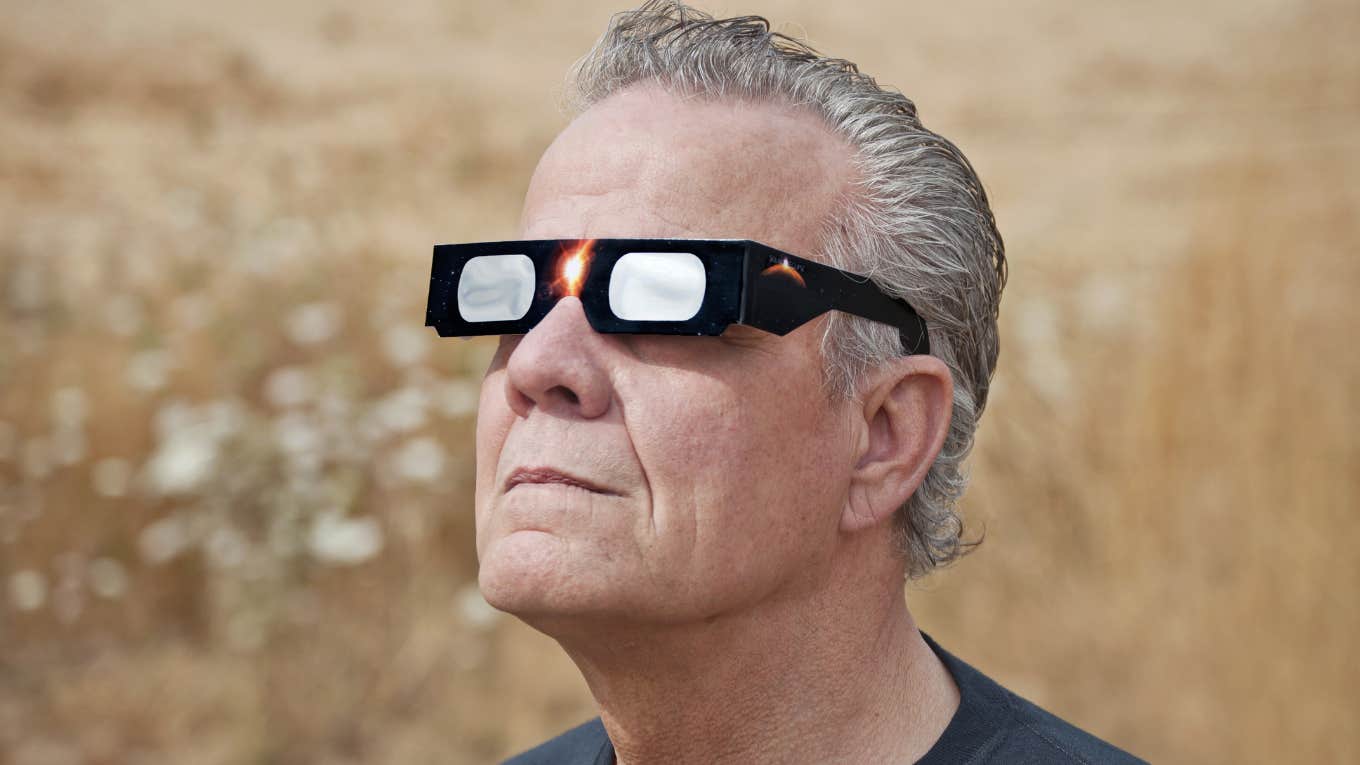 A Science Teacher Promised His Classes In 1978 They'd All Watch The Eclipse Together & Hundreds Showed 46 Years Later man wearing eclipse glasses
