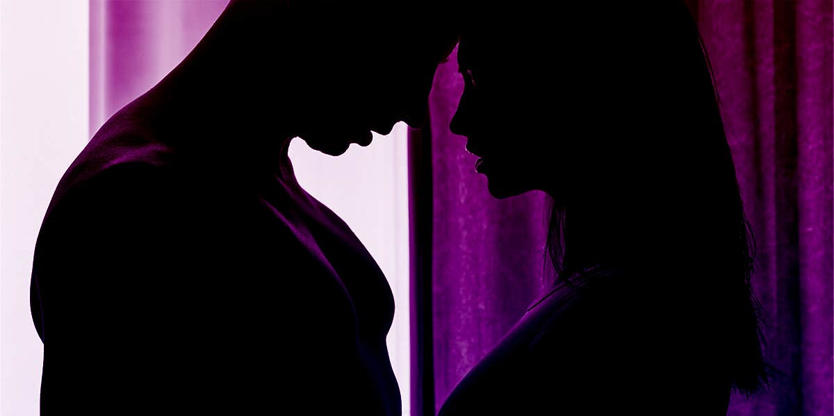 silhouette of couple kissing