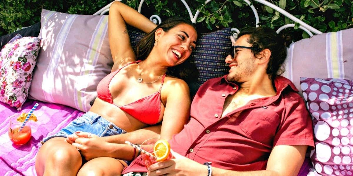 61 Second Date Ideas To Make It As Amazing As The First cute couple sitting on a hammock on their second date