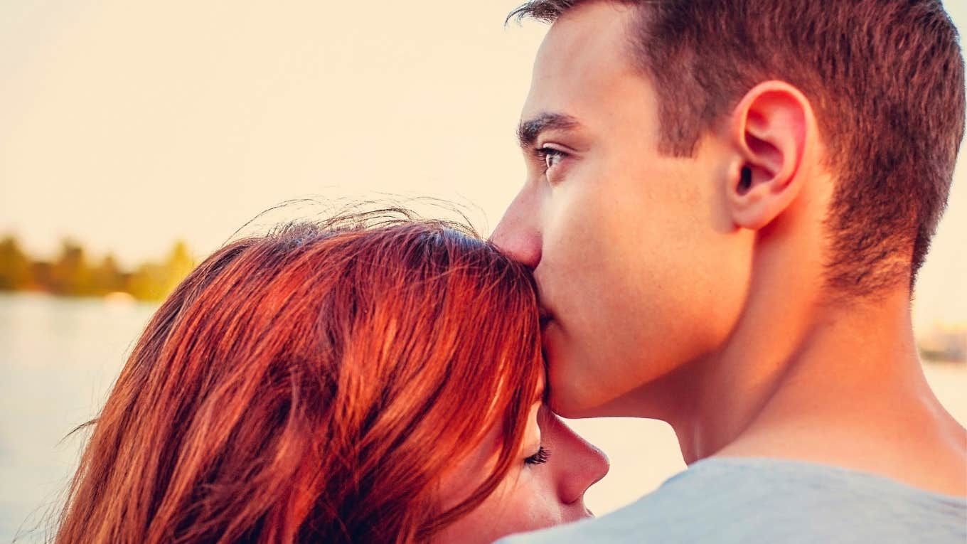 The Secret Thought Men Have When They Truly Love You Handsome young man kissing his girlfriend near the river