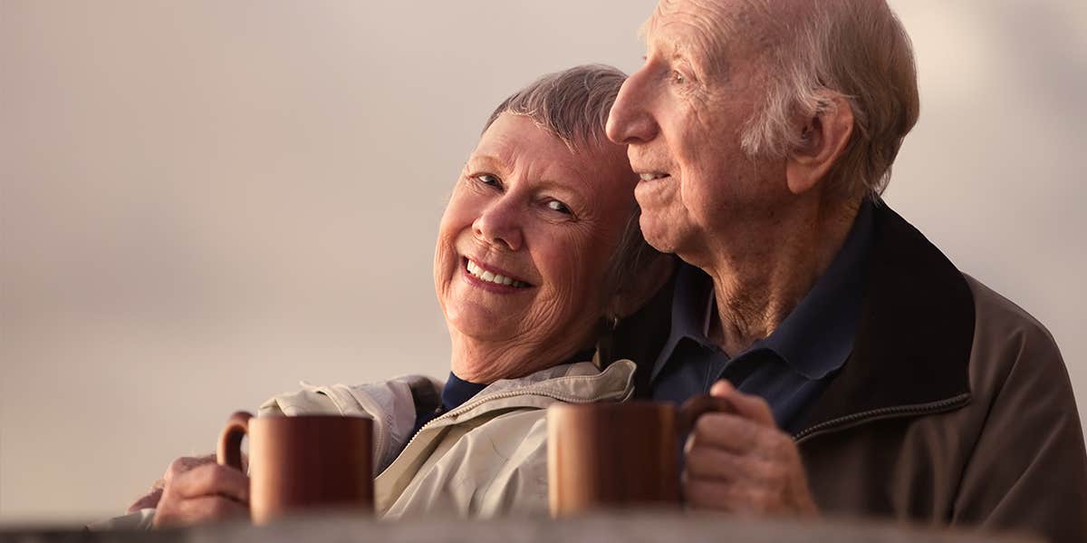 older couple embracing 