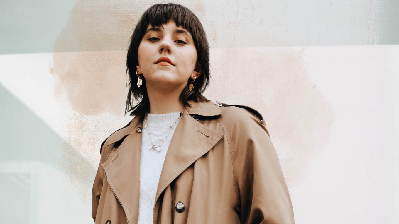 Secrets To Reinvent Your Life Woman in trench coat