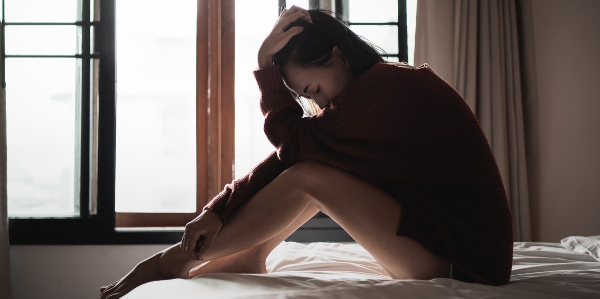 'Why Do I Hate Myself?' 4 Ways To Combat Self-Hatred woman on floor holding her head