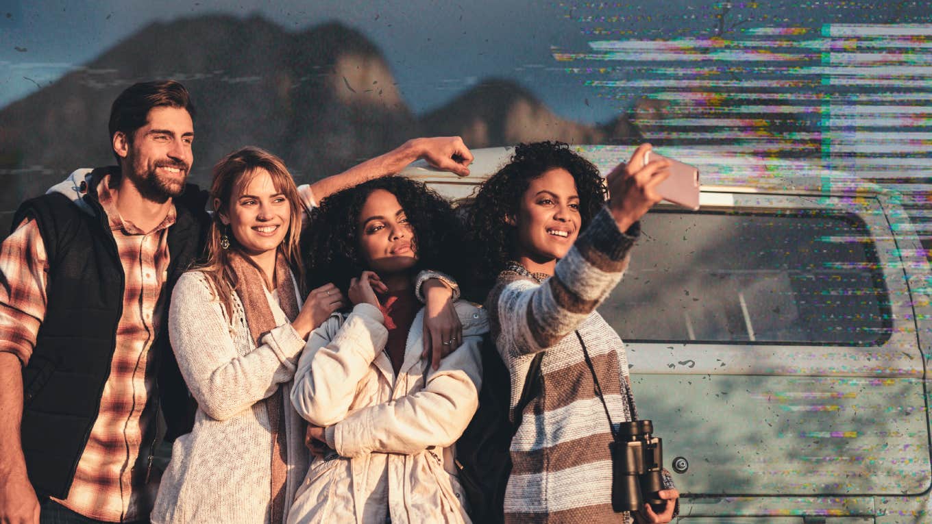 Man taking a selfie with a group of females